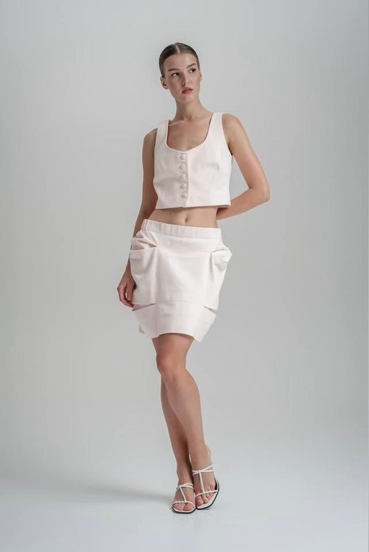 White outfit of vest & skirt